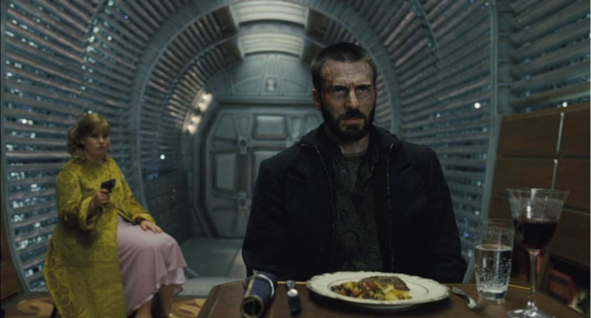 photo of Chris Evans sitting angrily at a dinner table