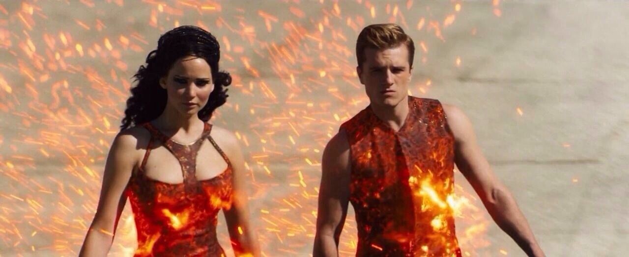 photo of Katniss and Peeta in their fire outfits