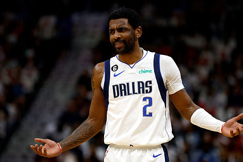Kyrie Irving of the Dallas Mavericks reacts to a fan on March 8