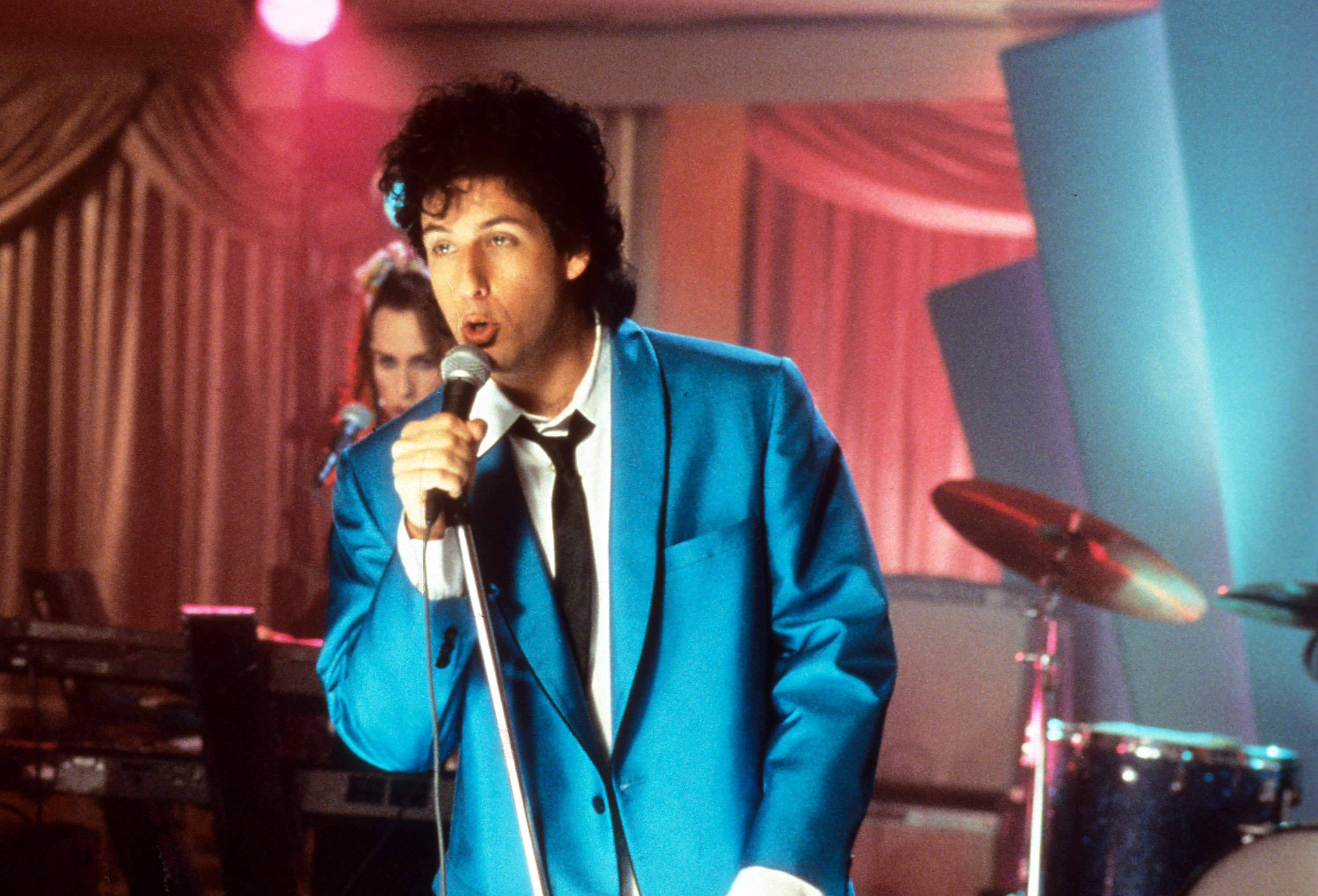 Adam Sandler sings in a scene from the film &#x27;The Wedding Singer&#x27;, 1998