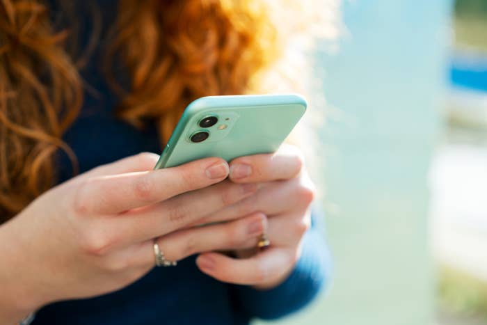 hands holding a cellphone