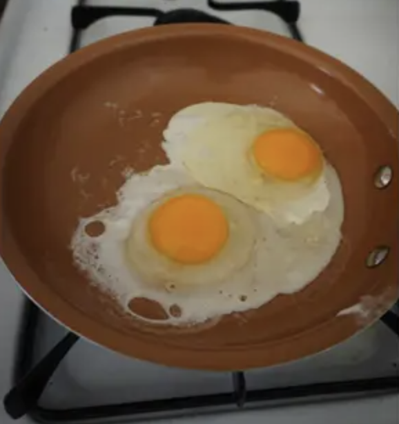 eggs cooking in a pan