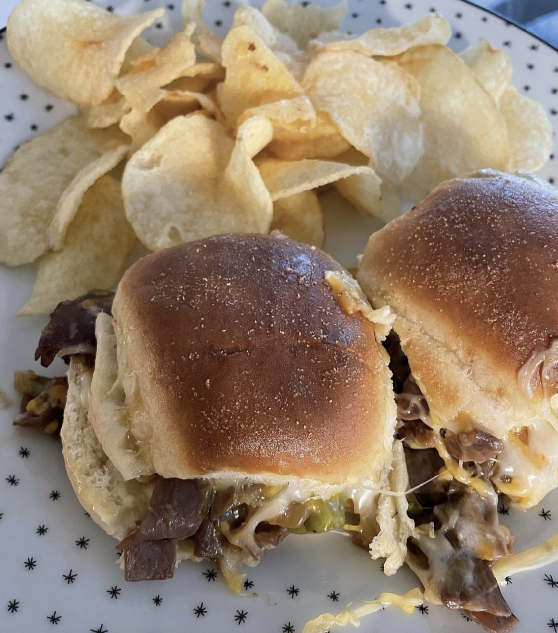 small slider burgers next to chips