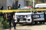 Photograph of Mexican police at crime scene