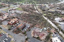 One person was killed and 28 hospitalized after a roof collapsed on a venue of concertgoers in Illinois, while five died in twisters in Arkansas.