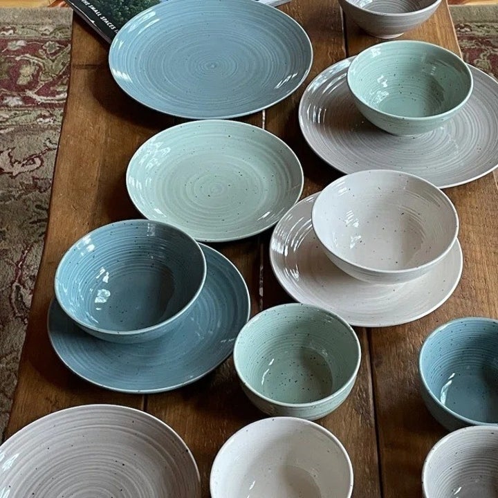 the multi-colored dish set on a table