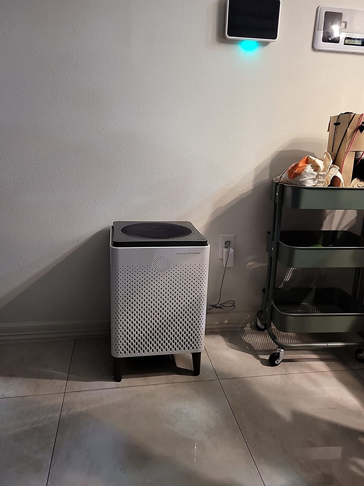The white air purifier in reviewer&#x27;s kitchen