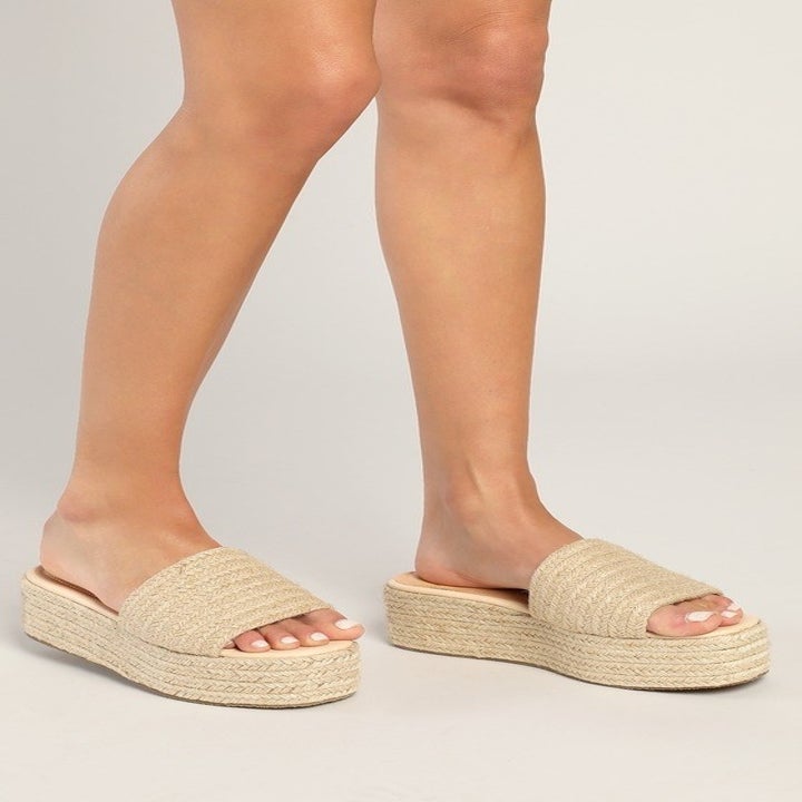 Image of model wearing beige sandals