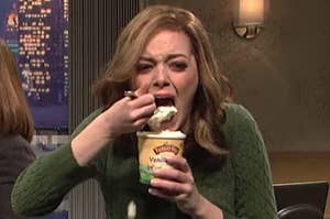 Emma Stone crying into a pint of vanilla ice cream in an SNL sketch