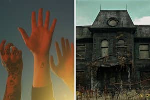 a hand reaching toward the sky next to a haunted house