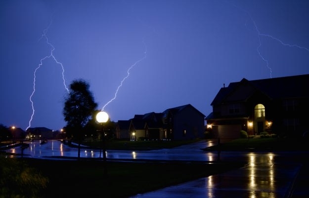Lightning strikes at during a storm at night in a suburb of Indianapolis