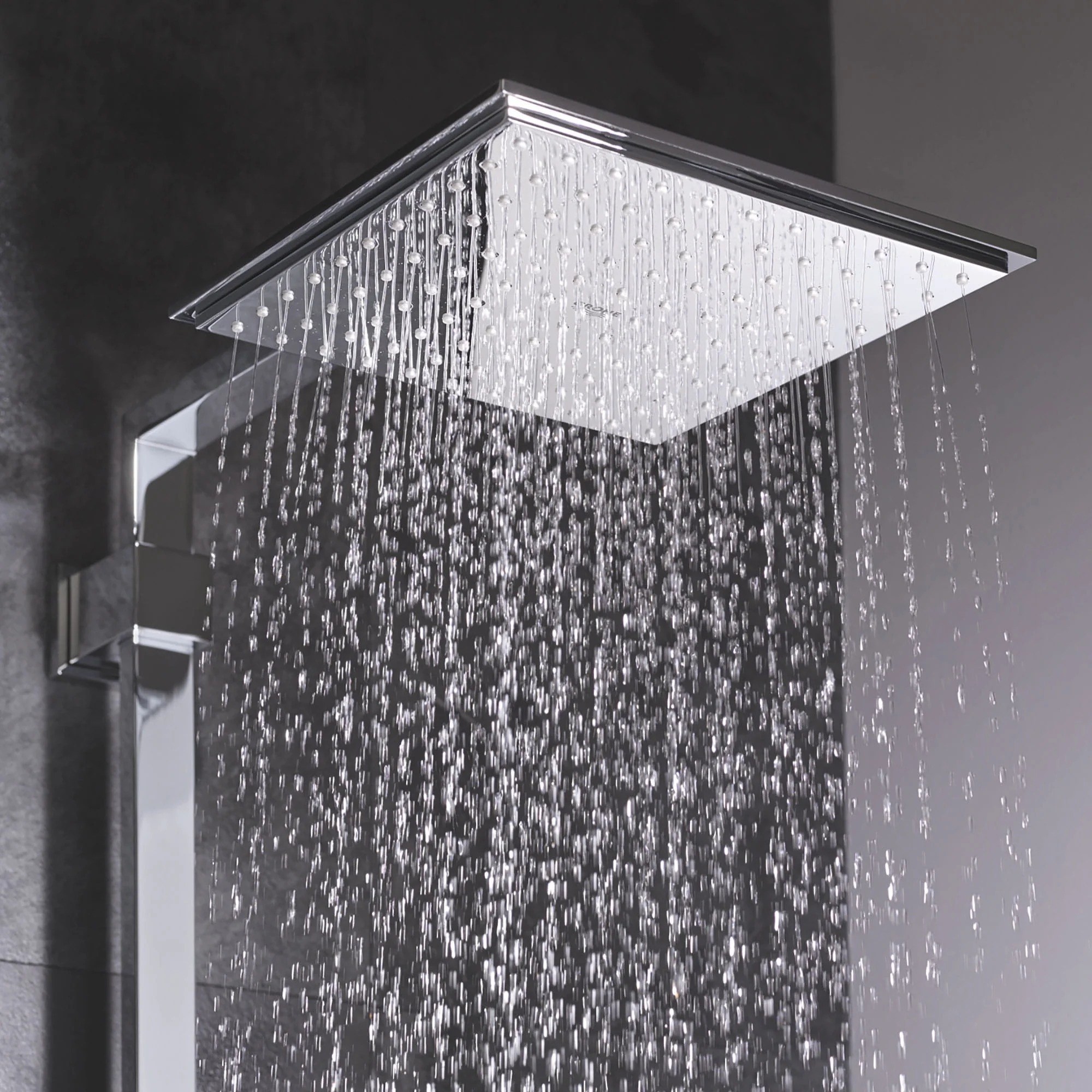 The rain shower head spouting water