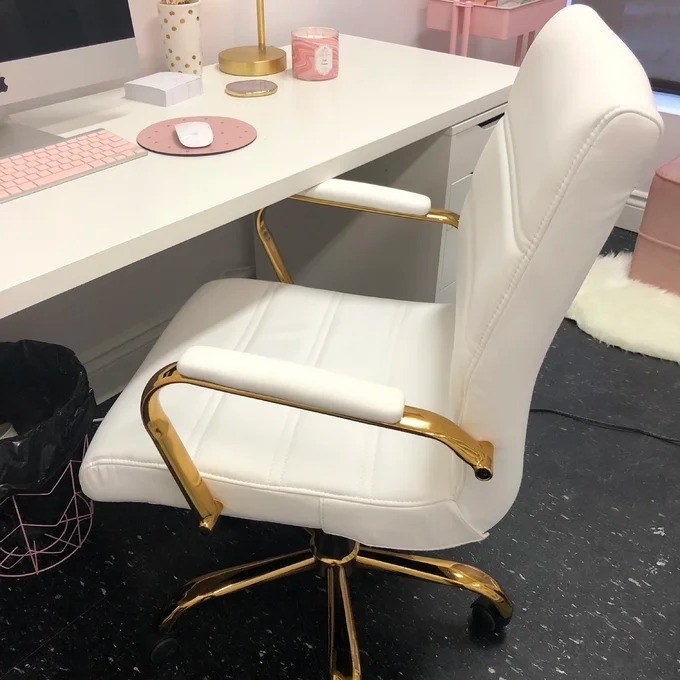 reviewer image of the chair in white with a gold frame