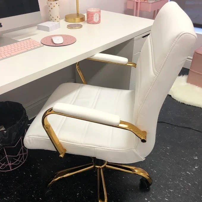 reviewer image of the chair in white with a gold frame