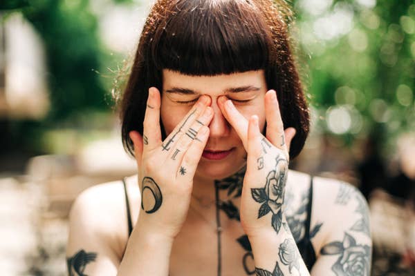 A person rubbing their eyes