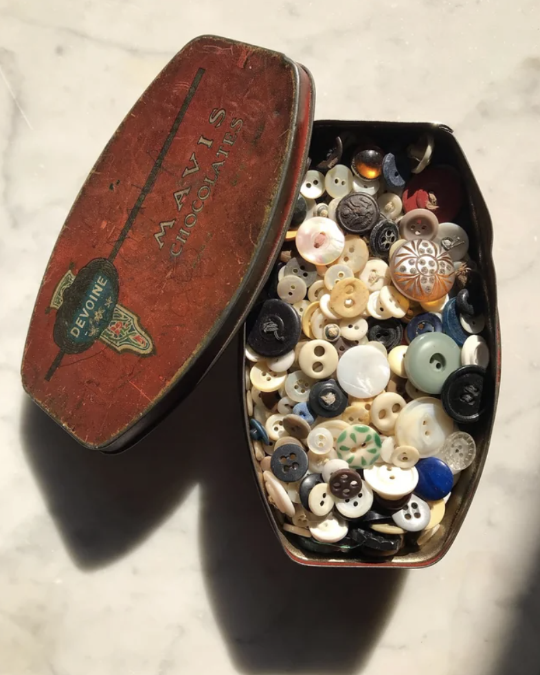 A tin full of buttons