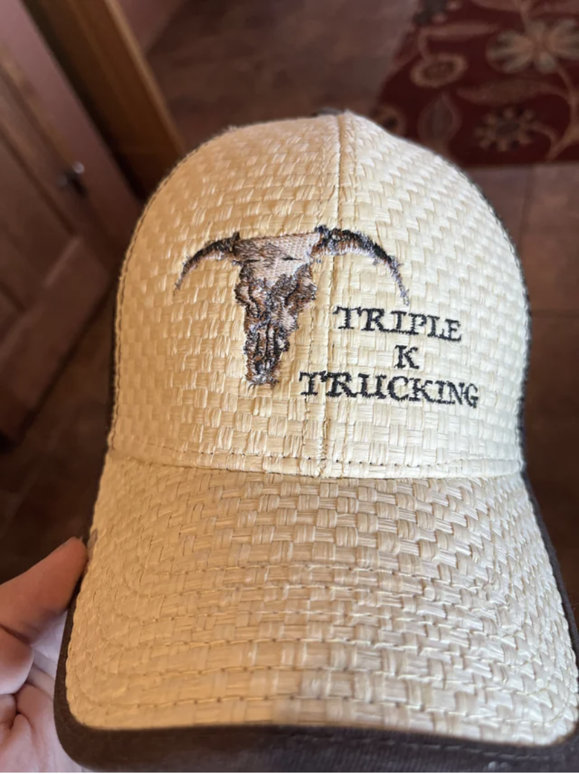 The hat reads &quot;triple K trucking&quot;