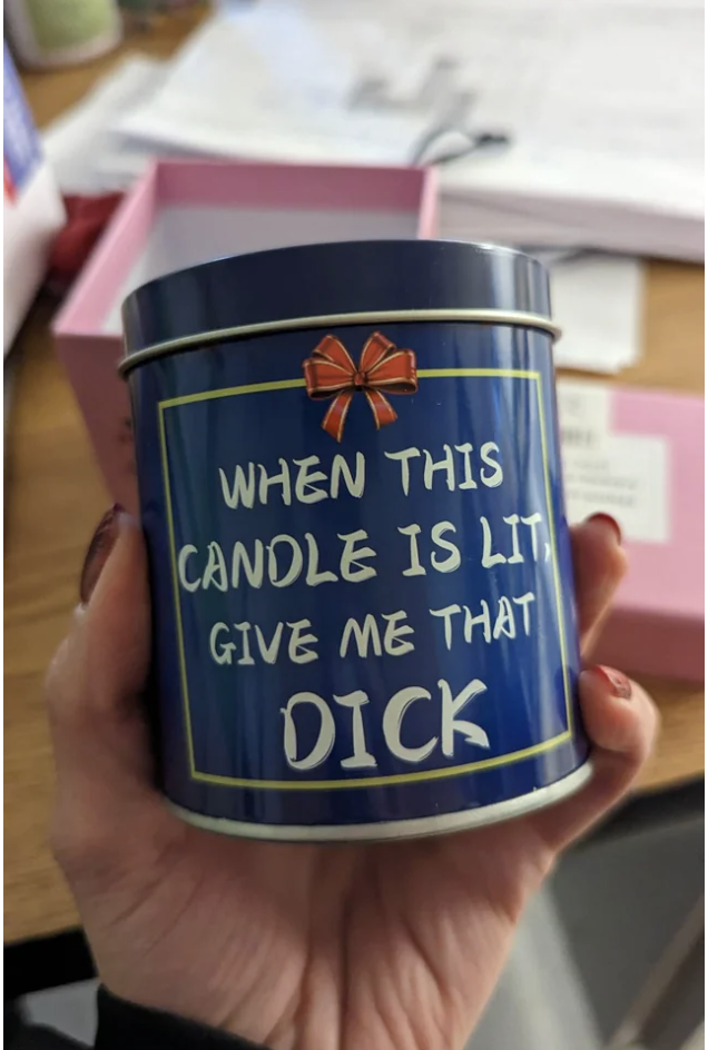The tin holding the candle reads &quot;when this candle is lit, give me that dick&quot;