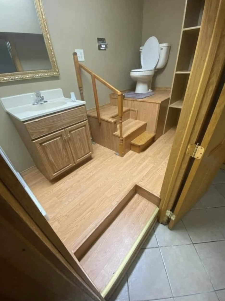 Stairs leading up to a toilet