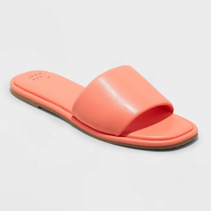 salmon colored slide sandals with a strap