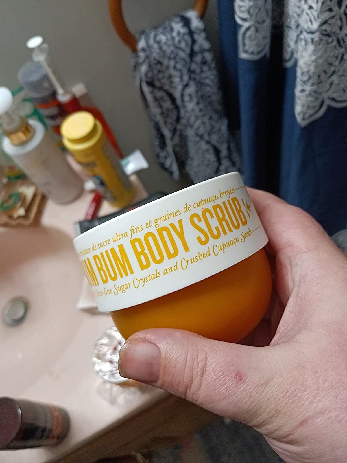 a reviewer holding the scrub