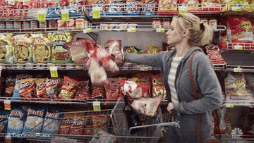 Eleanor putting everything in the grocery store in her cart on &quot;The Good Place&quot;