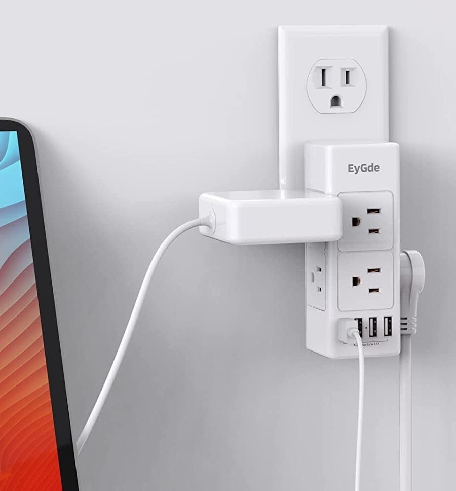 The outlet extender with several gadgets plugged into it