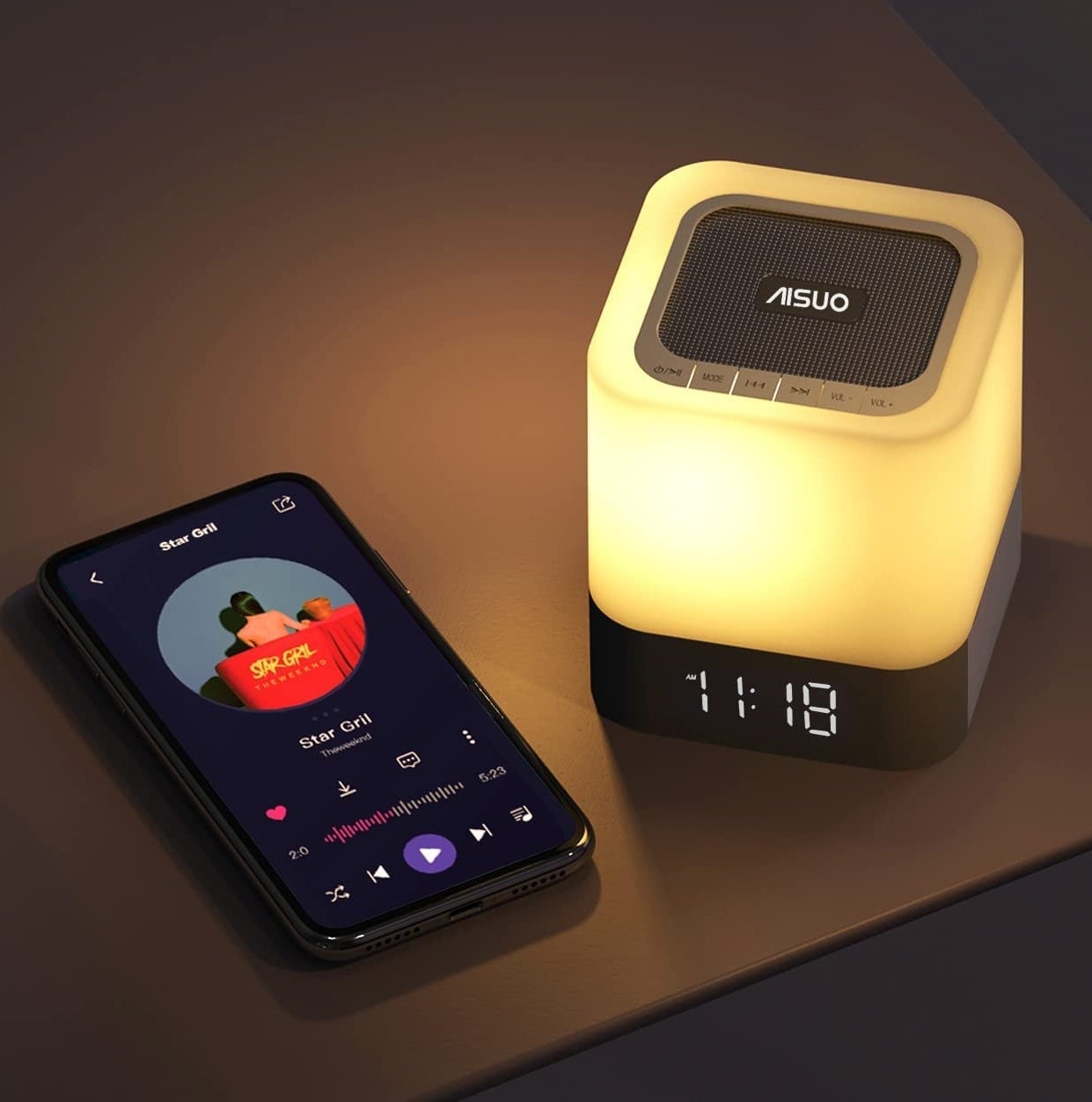 A phone beside the alarm clock
