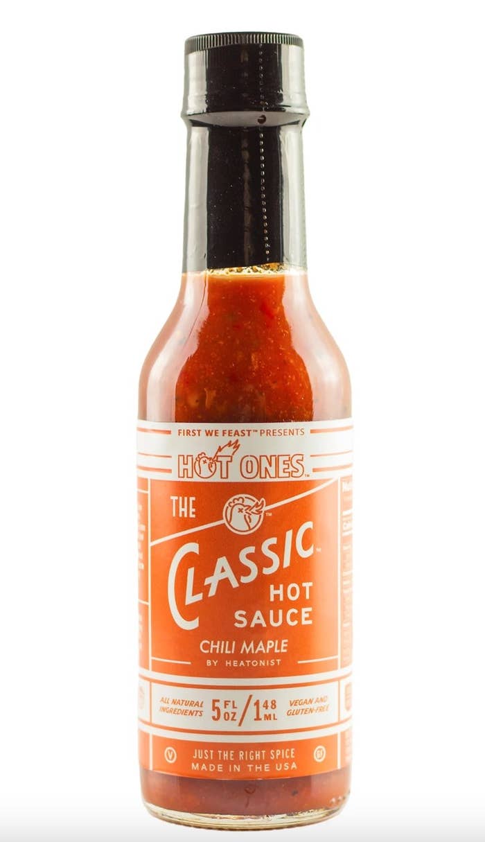 the bottle of hot sauce with a white and orange label