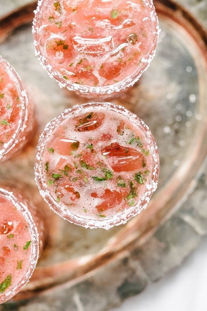 Strawberry basil margaritas on a tray.