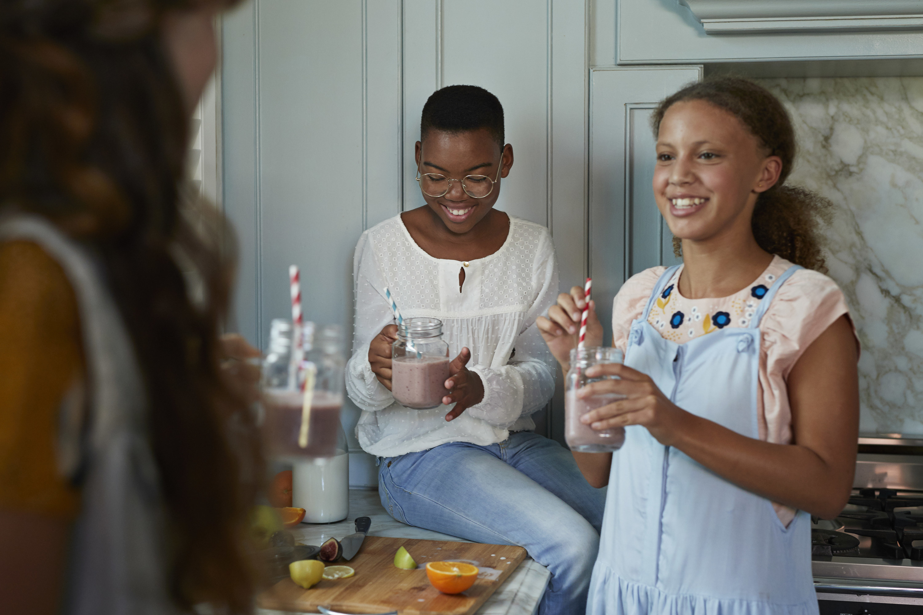teen girls using mason jars for their milkshakes