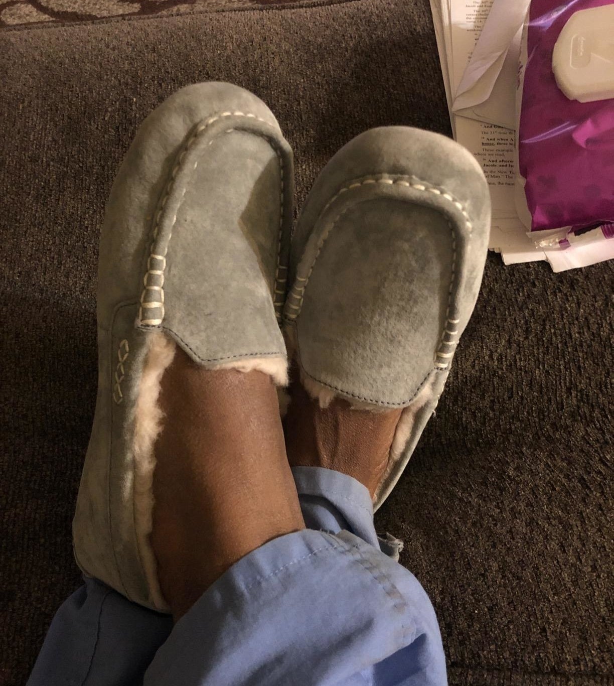 Reviewer wearing gray ugg slippers