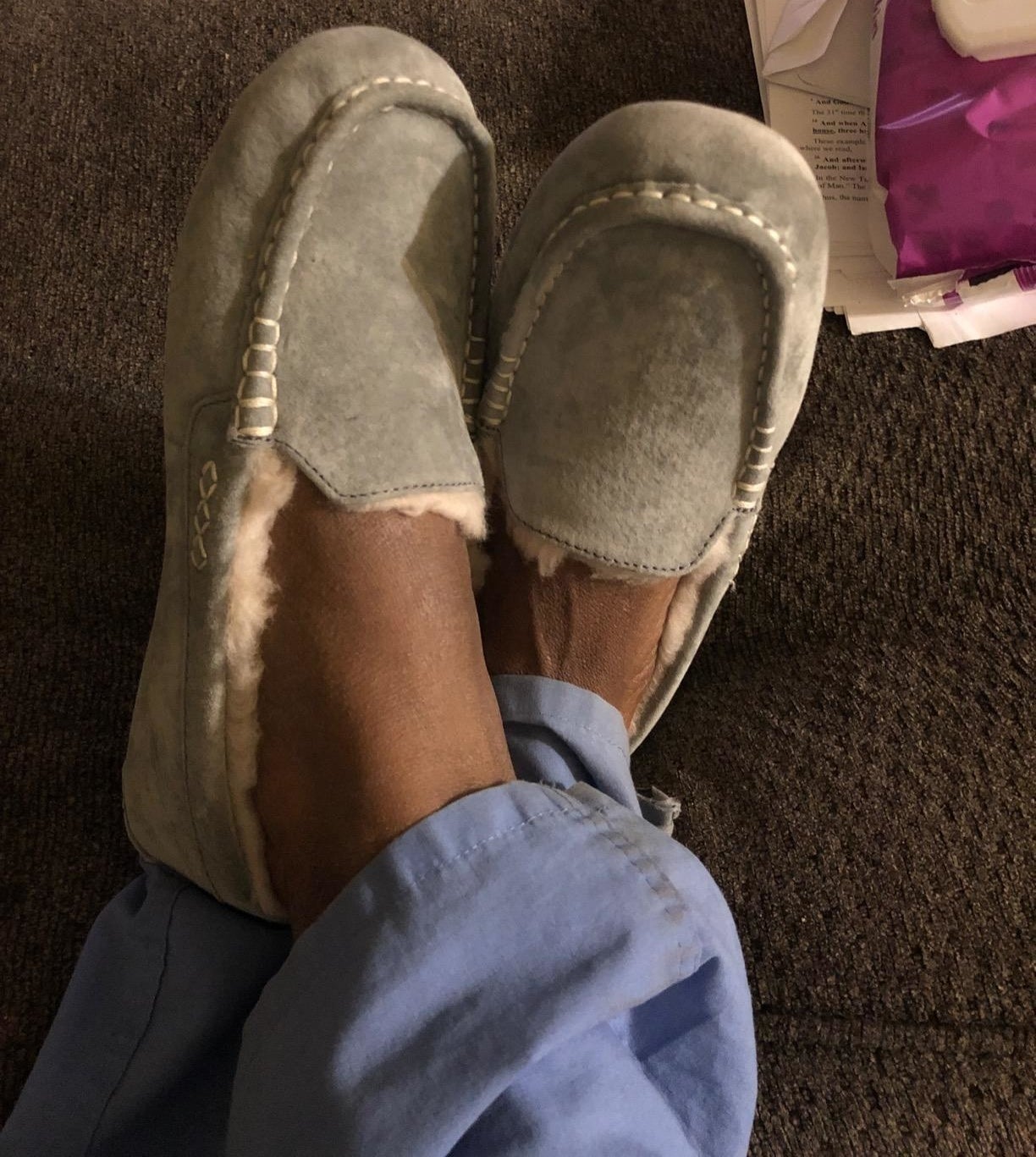 Reviewer wearing gray ugg slippers
