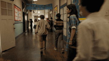 Margaret walking through the hall to her class