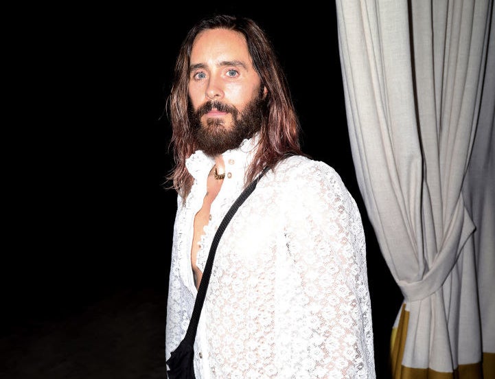 Jared in a lacy, long-sleeved top