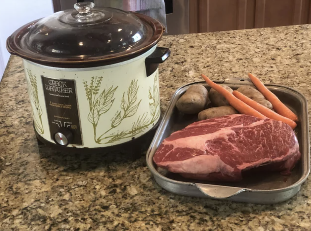 Food next to a crockpot on the counter
