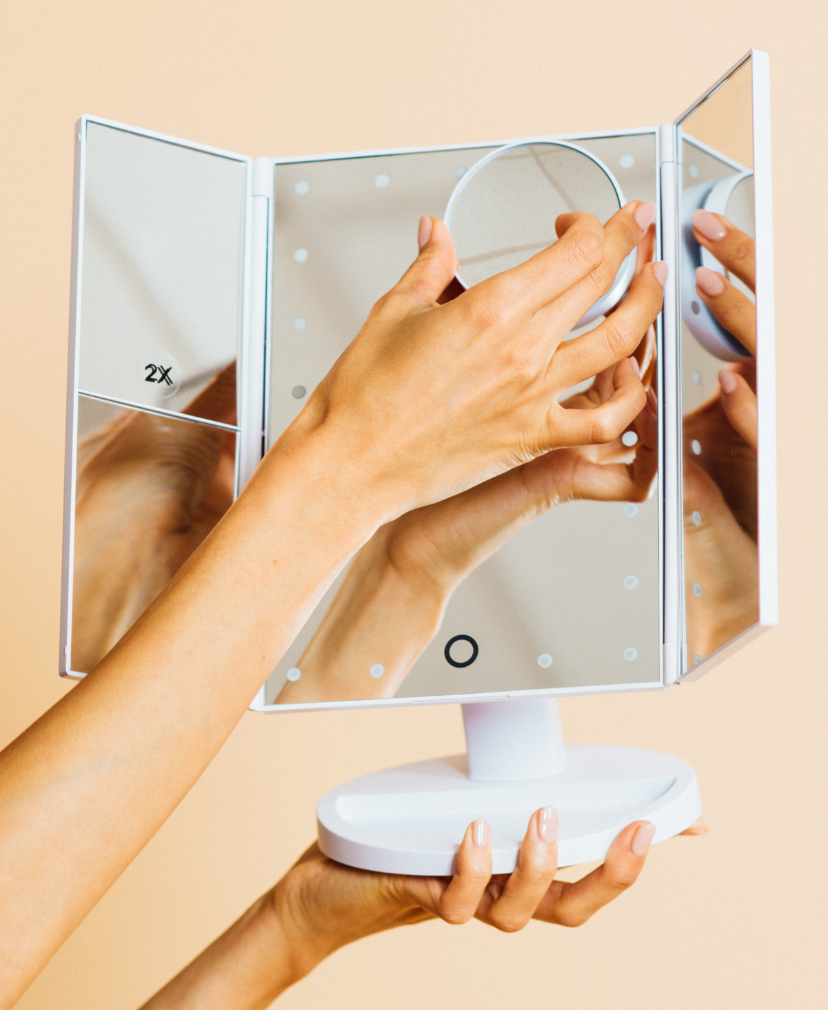 A person holding up the the mirror