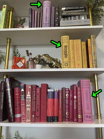 A reviewer's bookshelf with three bookshelf games blending in with real books