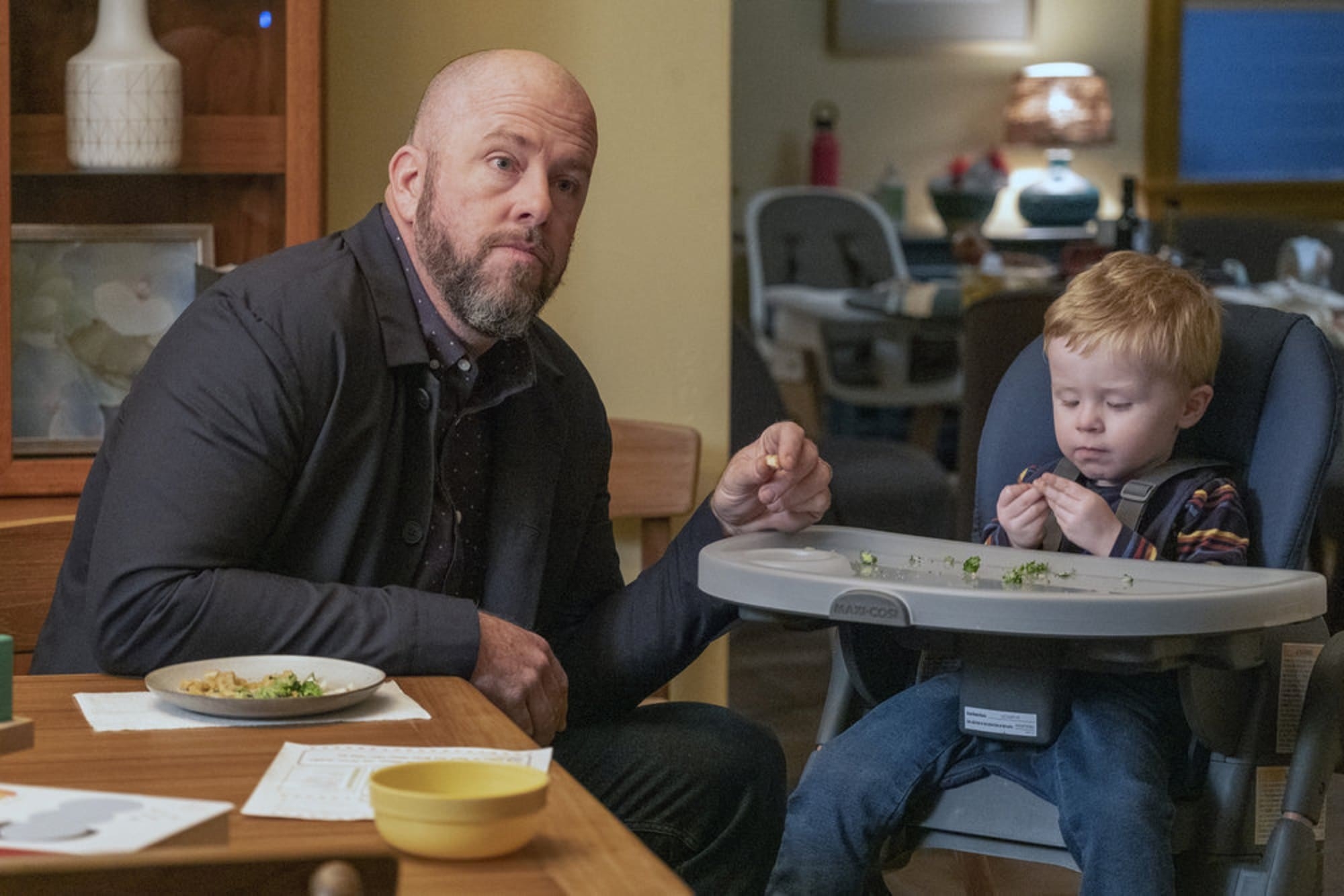 Toby from &quot;This Is Us&quot; with a toddler in a high chair.