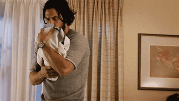 Jack from &quot;This Is Us&quot; rocking a baby.