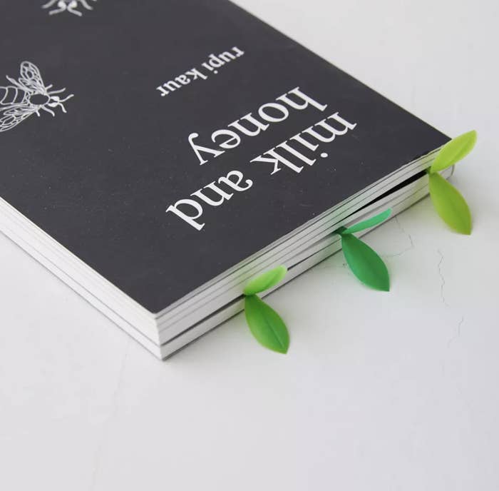 three of the sprout bookmarks in a book