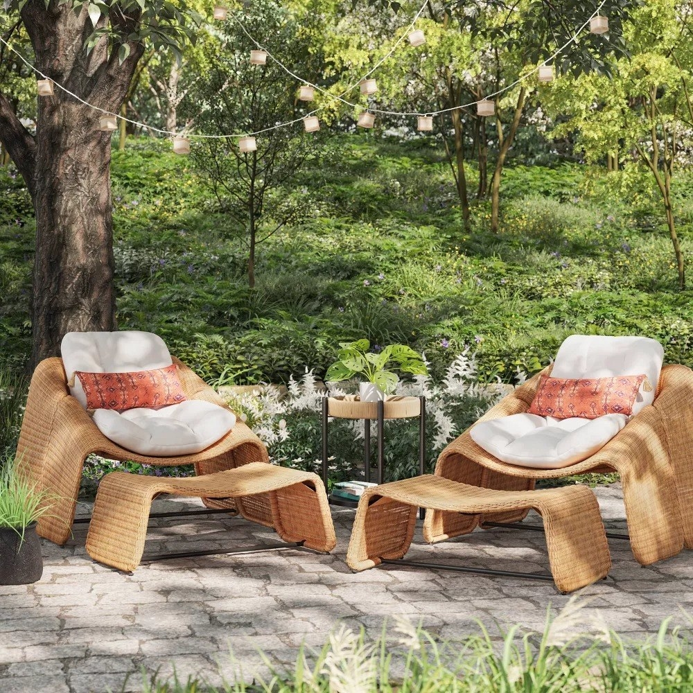 Two chairs and ottomans on a patio