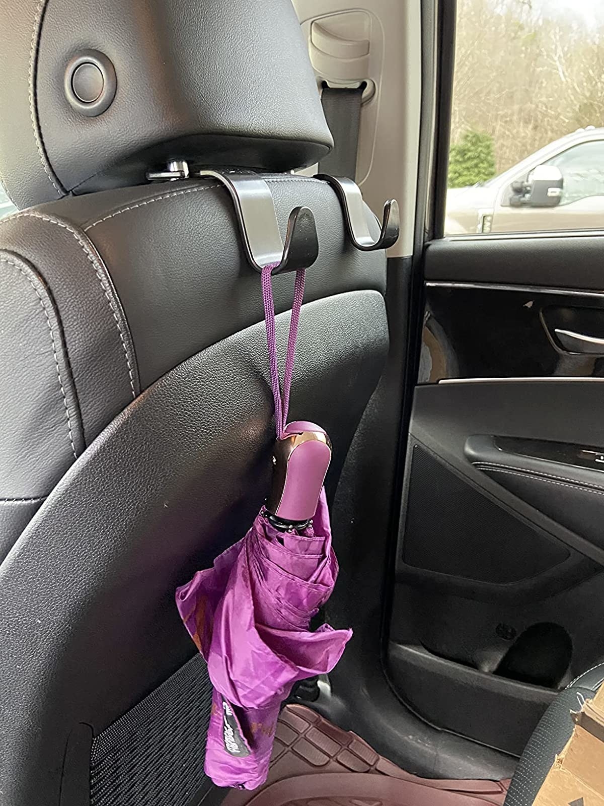 Reviewer image of an umbrella hanging on the car hook