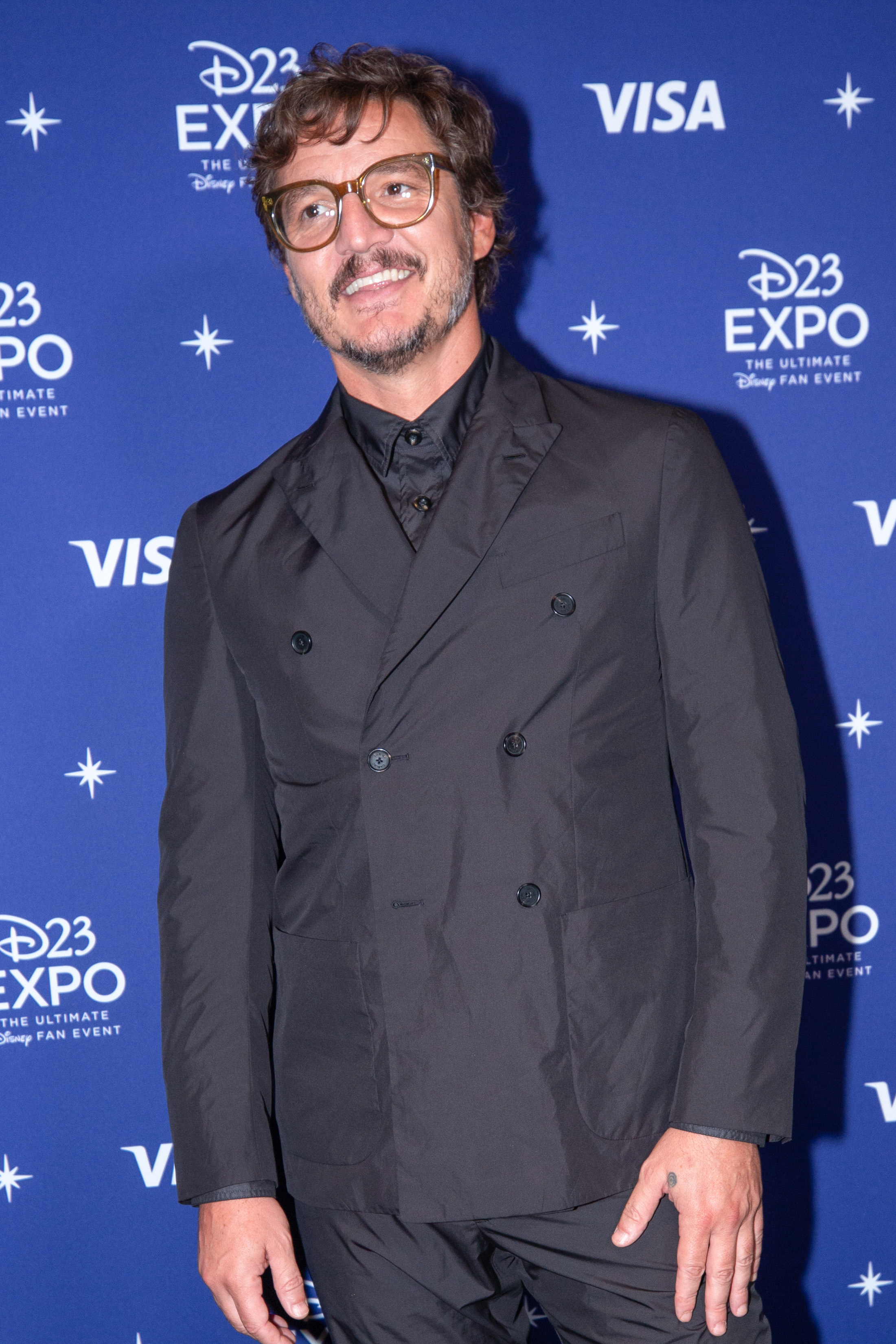 Pedro Pascal smiling on the red carpet