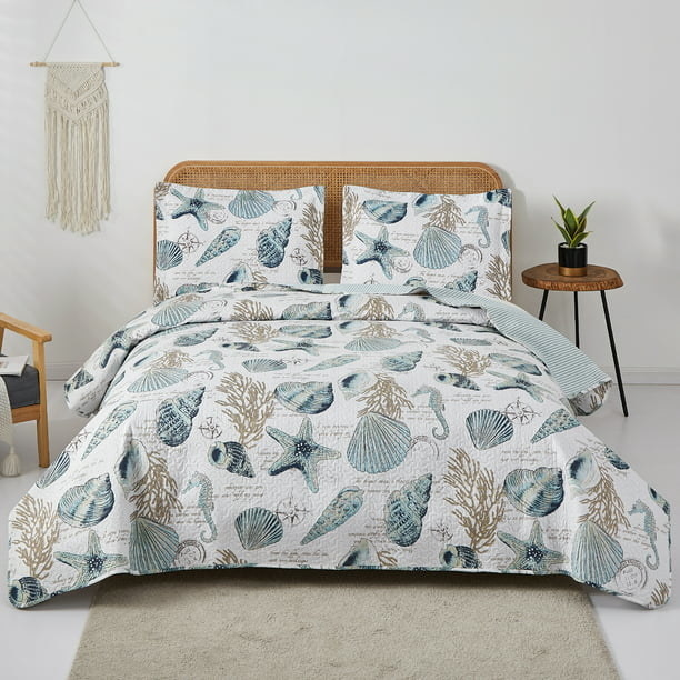 The seashell printed bedding on a bed