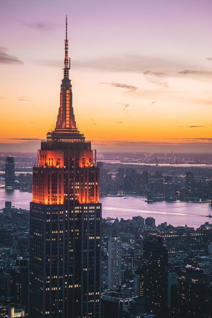 A close-up of the Empire State Building at night