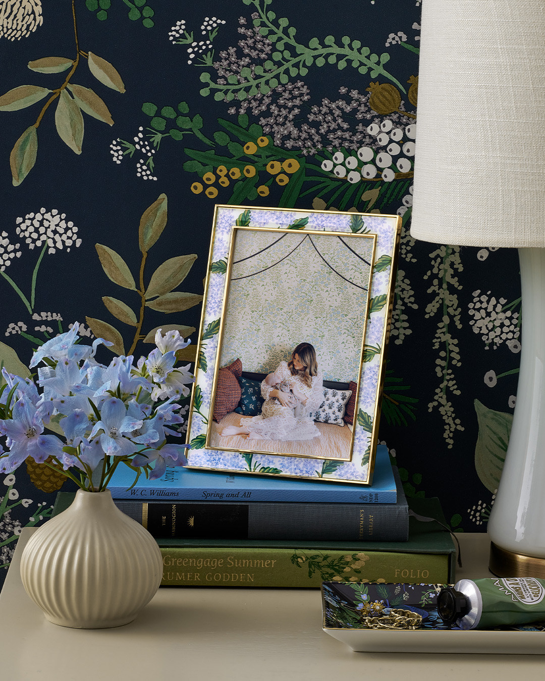 a picture frame with blue hydrangeas as the artwork around the frame