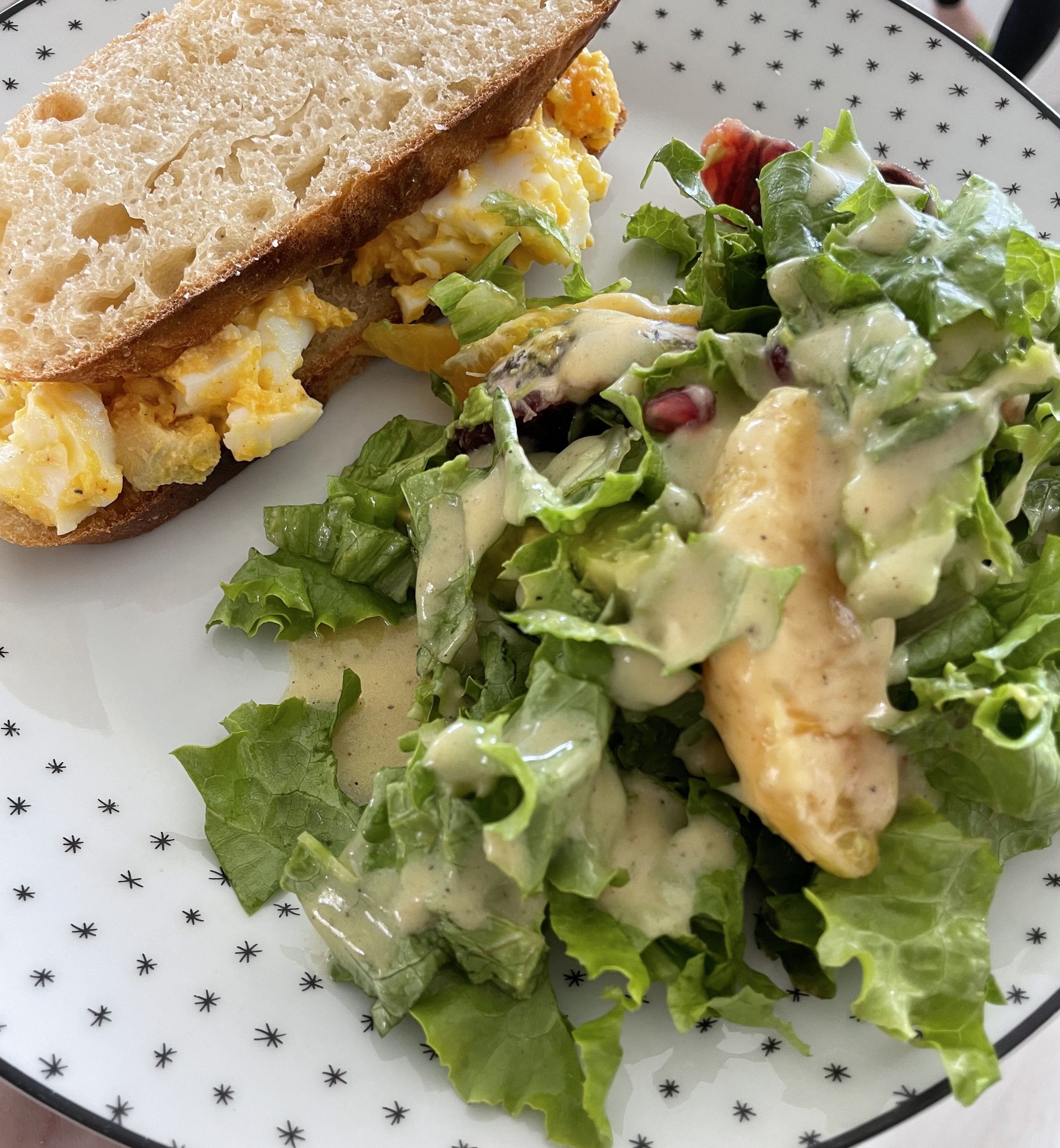 egg salad sandwich and salad on a plate