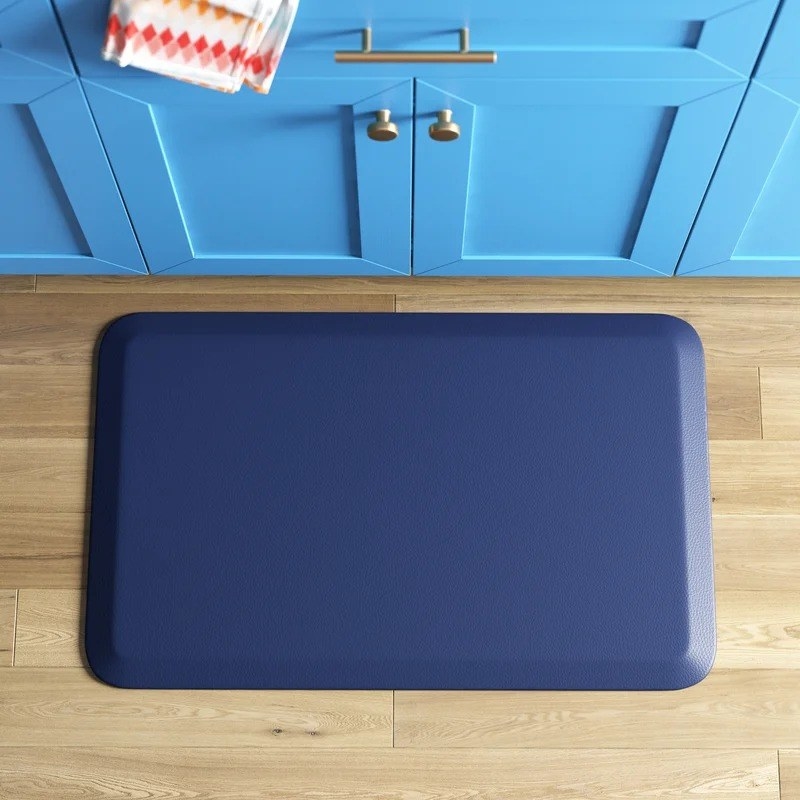 blue anti-fatigue mat on kitchen floor