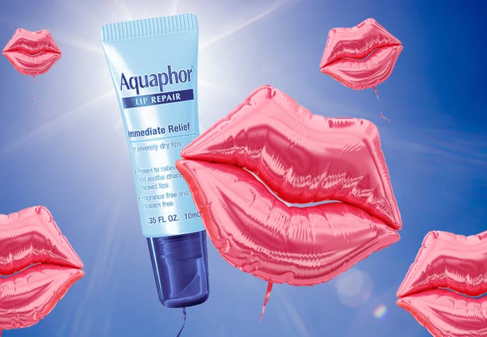 Inflatable baloons in the shape of lips and a tube of Aquaphor float into the sky